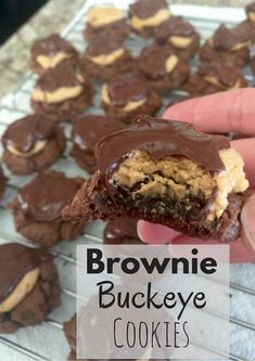 someone is holding up a chocolate cookie with peanut butter on it and the words brownsie buckeye cookies are in front of them