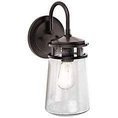 an outdoor wall light with a clear glass shade