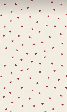 a white wall with red hearts on it