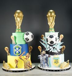 two cakes with soccer themed decorations on top of each one, both decorated in different colors and sizes