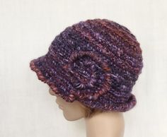 Crochet purple with multicolor (rust brown, lilac, dark grey) winter hat for women. Materials - different yarns with different chemical composition. Common fiber content : 30 % sheep wool, 7 % alpaca wool. 7 % silk, 1 % viscose, 46 % acrylic, 2 % polyamide. Size 57 - 60 cm (22 1/2 - 23 1/2 in.). Purple Brimmed Hats For Fall, Purple Winter Hat With Curved Brim, Wide Brim Purple Winter Hat, Purple Wide Brim Winter Hat, Brimmed Yarn Cloche Hat For Winter, Yarn Brimmed Cloche Hat For Winter, Winter Yarn Brimmed Cloche Hat, Handmade Brimmed Cloche Hat For Winter, Winter Yarn Cloche Hat With Brim