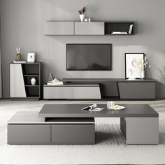 a modern living room with grey furniture and white carpeted flooring is featured in this image