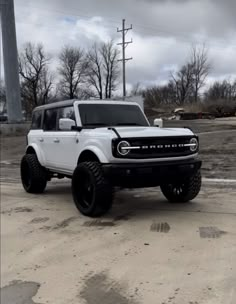 a white truck parked in a parking lot