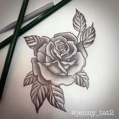 a pencil drawing of a rose with leaves on it and two green crayons next to it