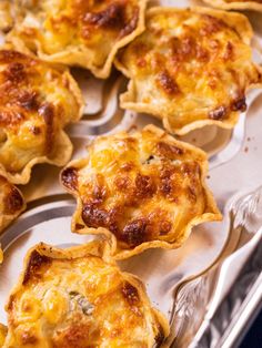 some food that is sitting on a metal tray and ready to be cooked in the oven