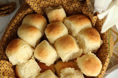 several rolls in a basket on a table