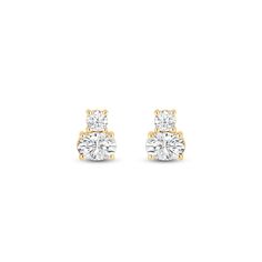 These two-stone stud earrings feature a design that embraces simplicity and elegance. Each stud has a two-stone setting, with a round diamond and an oval diamond set on prongs. The versatile look of this pair makes it suitable for any outfit or occasion. Blue Wedding Band, Diamond Earrings For Women, Oval Earrings, Gorgeous Engagement Ring, Moissanite Earrings, Diamond Anniversary Rings, Oval Earring, Bridal Bands, Stone Studs