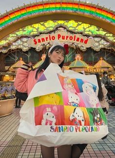 a woman in tights holding a shopping bag with sanrio purolland on it