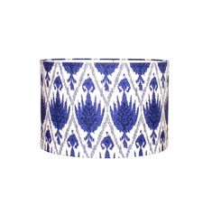 a blue and white lamp shade on a white background