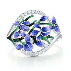 Introducing our Sterling Silver Blue Orchid Enamel Flower Ring, a breathtaking tribute to nature's beauty. Crafted with precision and care, this ring features delicate blue orchid enamel flowers accented with shimmering white zirconia gemstones. The intricate detailing and vibrant colors evoke the essence of a blooming garden, adding an enchanting touch to any ensemble. Whether worn as a statement piece or to elevate your everyday look, our Blue Orchid Ring is sure to capture hearts and turn hea Anniversary Flower Ring In Enamel, Anniversary Enamel Flower Ring, Anniversary Round Flower Enamel Ring, Blue Flower Ring For Anniversary, Enamel Flower Ring For Anniversary, Anniversary Flower Enamel Ring, Elegant Blue Jewelry With Birth Flower, Blue Birth Flower Jewelry For Anniversary, Elegant Blue Enamel Promise Ring