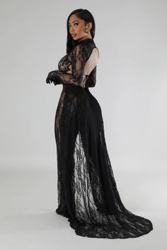 “Elegant Noir Lace Illusion Jumpsuit.” It features a luxurious black lace overlay that creates a seductive sheer effect. The high-neck top section with long sleeves and a solid black underlay bodice accentuates the figure, while the flowing sheer lace pants, extending into a dramatic train, add a touch of sophistication and grace. Perfect for a glamorous evening event, this jumpsuit marries boldness with elegance. Stretch jumpsuit Mock neck Long sleeve Open back Tail Mesh Undergarments not inclu Black Lace Two Piece Set, Black Mesh Outfit, Mesh Outfit, Stretch Jumpsuit, Casual Beach Wear, Lace Pants, High Fashion Outfits, Mock Neck Long Sleeve, Glamorous Dresses