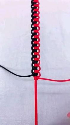 a red and black object with wires attached to it