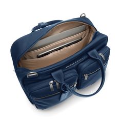 Designed to fit perfectly in the overhead bin, this carry-on is as functional as it is elegant. Its two exterior compartments are ideal for your travel essentials—while its main compartment is roomy enough for your must-have outfits and backups, too. Fits up to a 15" laptop. SKU: P251-5 Laptop Compartment Slip-Through Back Panel INTERIOR FEATURES Cavernous main compartment holds an assortment of items both large and small. Internal organizer with two slip pockets, business card slip pockets, and pen loops. Keep your water bottle secure but accessible with an interior pocket. Tech section in main compartment includes an integrated padded laptop sleeve protects most 15" computers and slip pocket for a tablet. Fabric lining is durable and soft in a contrasting color that makes finding content Versatile Duffle Bag With Functional Pockets For On-the-go, Functional Travel Accessories With Removable Pouch, On-the-go Shoulder Bag With Functional Pockets And Double Handle, Functional Travel Accessories With Pockets For On-the-go, Functional Weekender Bag With Pockets For On-the-go, Functional Satchel Luggage For Weekend Trips, Functional Travel Bag With Removable Pouch For Weekend Trips, Functional Travel Bag With Zipper Pocket For On-the-go, Functional Tote Luggage With Removable Pouch