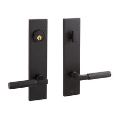 two black door handles with brass knobs on each side and one has a keyhole in the middle