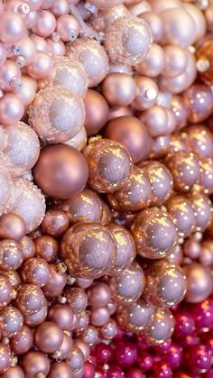 many different colored ornaments are stacked together