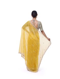 Look like a royalty in this exquisite yellow embroidered organza silk saree at weddings and special occasions. It comes with a beautiful sage green embroidered blouse. Organza Silk Saree, Embroidered Sarees, Fashion Journals, Embroidered Organza, Kanjivaram Sarees, Traditional Fabric, Organza Saree, Saree Online, Indian Saree