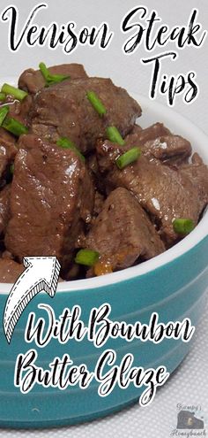 a blue bowl filled with beef and green onions on top of a white tablecloth