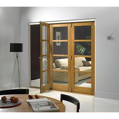 a living room filled with furniture and a sliding glass door