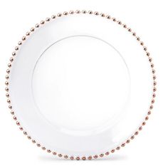 a white plate with gold beading on the rim and bottom, against a white background