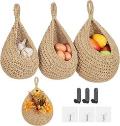 three baskets filled with eggs and vegetables next to hooks on the side of each bag