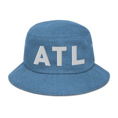 Here’s a custom ATL denim bucket hat. The letters ATL are embroidered on the front. Represent Atlanta, GA in style when your running errands or out on the town. Here’s some more details about your hat: • 100% cotton • 2 sewn eyelets on each side of the hat • Poplin sweatband • One size fits most Casual Outdoor Bucket Hat With Letter Print, Summer Sports Cotton Bucket Hat, Summer Sports Bucket Hat In Cotton, Summer Cotton Bucket Hat For Sports, Sports Cotton Bucket Hat, Cotton Sports Bucket Hat, Sporty Cotton Bucket Hat, Casual Streetwear Bucket Hat With Embroidered Logo, Casual Bucket Hat With Letter Print