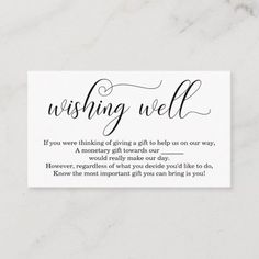 a white business card with the words wishing well written in cursive writing on it