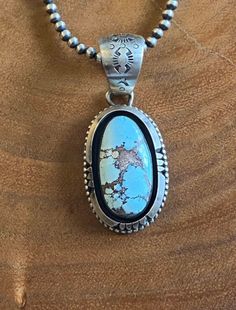 Sheila Becenti Golden Hills Turquoise Sterling Silver Pendant. It measures 2 5/8 inches long and 1 1/8 inches wide. Signed by artist and stamped sterling silver. Pendant Only Thanks for checking out my store and if you have any questions please message me. SKU:39663104720981_febe81b* Southwestern Engraved Turquoise Necklace In Sterling Silver, Engraved Silver Southwestern Turquoise Necklace, Engraved Silver Turquoise Necklace In Southwestern Style, Engraved Turquoise Sterling Silver Necklace, Collectible Engraved Turquoise Necklace, Southwestern Engraved Turquoise Necklace, Southwestern Silver Oval Turquoise Necklace, Engraved Southwestern Turquoise Necklace, Engraved Turquoise Southwestern Jewelry