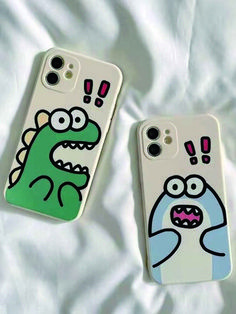 two cell phones with cartoon drawings on them sitting on a white bed sheet, one has a green monster and the other is a blue monster