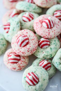 christmas sprinkle cookies on a white plate