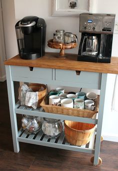 a kitchen island with baskets on it and a coffee maker sitting on top of it