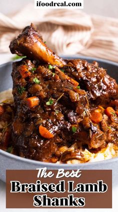 the best braised lamb shanks with carrots and gravy in a bowl