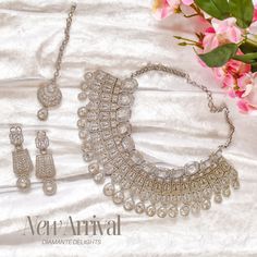 Be splendidly sophisticated in our Sneha Set! This intricate & elegant set features CZ stones, making it a perfect pick for a special occasion. The set includes a necklace, a maang teekah and a pair of matching earrings. Please click on the video for a detailed view of the product. Silver-plated on high-quality brass as base metal. Made by order. Kindly allow 5-7 weeks for the delivery of this item. For custom or urgent requests, please contact support@alacouture.com. *Please Note: We use faux s Elegant Sets, Waist Chain, A Necklace, Head Accessories, Gift Card Shop, Cz Stone, Base Metal, Matching Earrings, Ring Gift