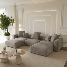 a living room with a large sectional couch and coffee table