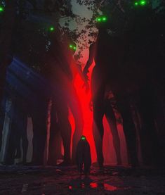 a man standing in the middle of a forest with red and green lights on his face