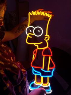 the simpsons neon sign is lit up and ready to be used as an art piece