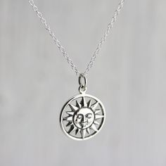 Sterling Silver Smiling Sun Charm Necklace. The largest object visible in our vast sky, the sun is the source of light, heat, and life. Feel the warmth of the sweet, smiling sun face in this classic celestial design. » Sterling Silver Smiling Sun Charm (21.5mm including jump ring x 15.25mm) » Sterling Silver Cable Chain (select from drop-down on upper right) » Your jewelry purchase will come beautifully packaged for gift giving. Personalize It: ✧ Add a Birthstone Crystal: http://etsy.me/2v0gADY Silver Celestial Necklace With Sun Design, Sterling Silver Sun Design Spiritual Necklace, Celestial Sterling Silver Necklace With Sun Design, Spiritual Silver Necklace With Sun Design, Silver Sun Necklace With Sun And Moon Design, Silver Sunburst Necklace For Gift, Silver Necklace With Sun And Moon Design, Sterling Silver Sun Design Necklace, Symbolic Silver Necklace With Sun Design