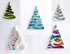 four different christmas trees made out of paper