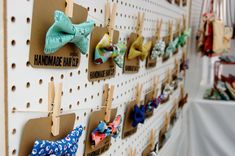 there are many bow ties hanging on the wall