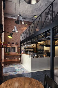 the interior of a restaurant with exposed brick walls and ceiling lights hanging from the ceiling