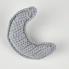 a crocheted object sitting on top of a white surface