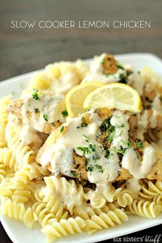 a white plate topped with chicken and pasta