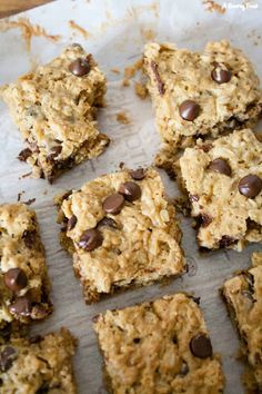 chocolate chip cookies and oatmeal bars on a baking sheet ready to be eaten