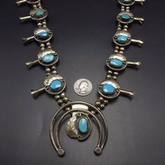 "VINTAGE NAVAJO SQUASH BLOSSOM NECKLACE DESCRIPTION: This classic Navajo squash blossom necklace features 13 specimens of brilliant blue Morenci turquoise. The gemstones are secure in micro-serrated bezel, on a foundation of heavy gauge vintage sterling silver. Applied leaves flank each of the high blue gemstones. This necklace will be a valuable addition to your collection of fine vintage Native American jewelry. MEASUREMENTS: Necklace measures 32\" end to end Naja measures 2 1/2\" x 2 1/2\" Be Vintage Blue Turquoise Necklace Collectible, Collectible Vintage Blue Turquoise Necklace, Retro Turquoise Jewelry For Collectors, Retro Turquoise Jewelry For Collectible, Retro Turquoise Jewelry Collectible, Vintage Blue Turquoise Necklace For Jewelry Making, Vintage Turquoise Necklace For Jewelry Making, Vintage Squash Blossom Necklace, Antique Turquoise Jewelry