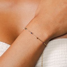 The 2MM Satellite bracelet is a dainty extension of our famous Master Healer Collection, designed to amplify the healing energy of it's natural stones. Stimulating all seven chakras and magnified by their proximity to each other, these powerful stones bring an all encompassing feeling of balance and healing to the mind and body. Wear this bracelet with intention to embrace the earth-born powers and experience benefits such as peace, prosperity, strength, courage, love, and compassion! Featured S Natural Stones Jewelry For Friendship, Dainty Adjustable Gemstone Chain Bracelet, Spiritual Birthstone Crystal Bracelet, Minimalist Adjustable Gemstone Chain Bracelet, Minimalist Adjustable Birthstone Chain Bracelet, Minimalist Adjustable Chain Bracelet With Birthstone, Everyday Gemstone Crystal Bracelet, Minimalist Adjustable Birthstone Beaded Bracelet, Minimalist Adjustable Beaded Birthstone Bracelet