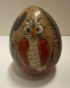 an egg with an owl painted on it