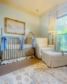 a baby's room is decorated in white and blue