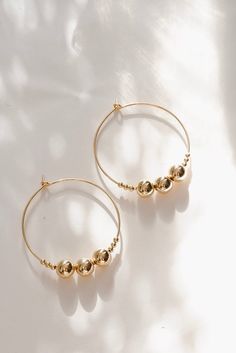 These beaded hoops are the perfect every day earrings.  Beads range from 2 to 6mm.  Priced per pair.  Choose from 14 karat gold fill or sterling silver. Earrings are about 1.25 inches. Handmade by Metrix Jewelry in NYC. All products are made to order, please allow up to 1 week before shipping. Contact Hello@MetrixJewelry.com if you require expedited service. Cheap Hoop Earrings With Gold Beads For Gifts, Earrings Beads, Hoops Silver, Triangle Ring, Earrings Hoops, Personalized Gift Wrap, Hoop Earrings Gold, Earrings Beaded, Earrings Hoop