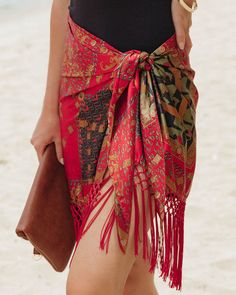 Wrap 100% Polyester Hand Wash Cold. Dry Flat Mini Length Lightweight Fabrication Fringe Trimming Tie Closure Not Lined Look chic by the beach in our Caballera Fringe Cover Up in red multi that features a tie closure.Styled with: Perfect Hoops.... Bohemian Red Sarong For Vacation, Red Bohemian Sarong For Vacation, Red Bohemian Sarong For Festivals, Off Shoulder Evening Gown, Boho Summer Outfits, Simple Bangle, Cami Bodysuit, Mini Necklace, Mini Skater Dress