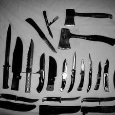 an assortment of knives are displayed in black and white