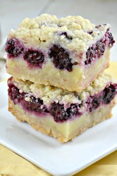 two blueberry crumb bars stacked on top of each other